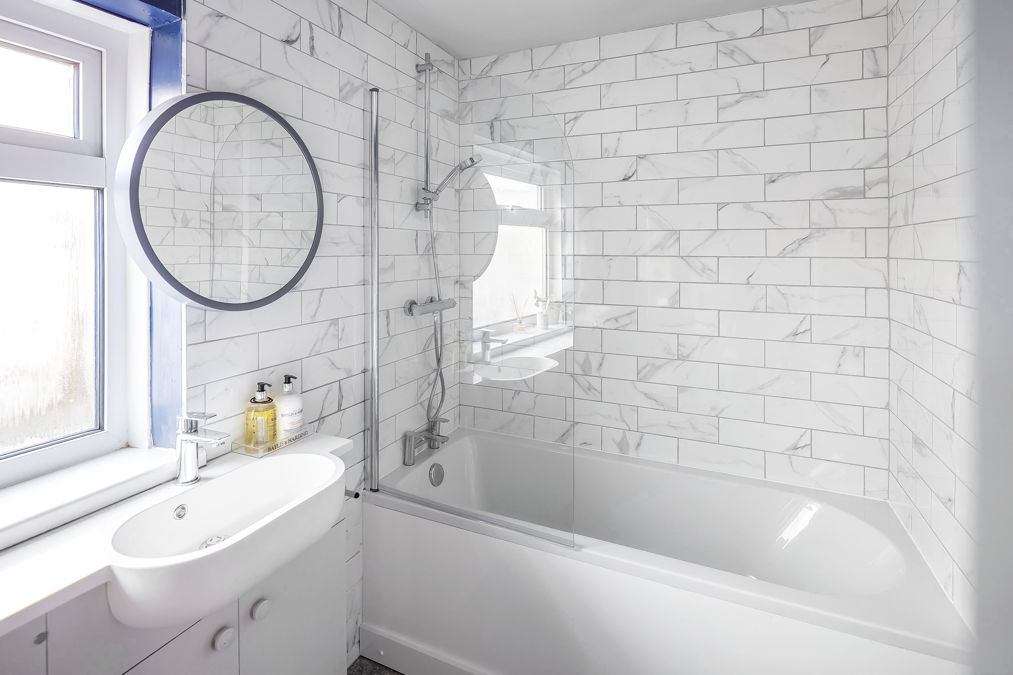 Stylish bathroom with modern fixtures and heated towel rail