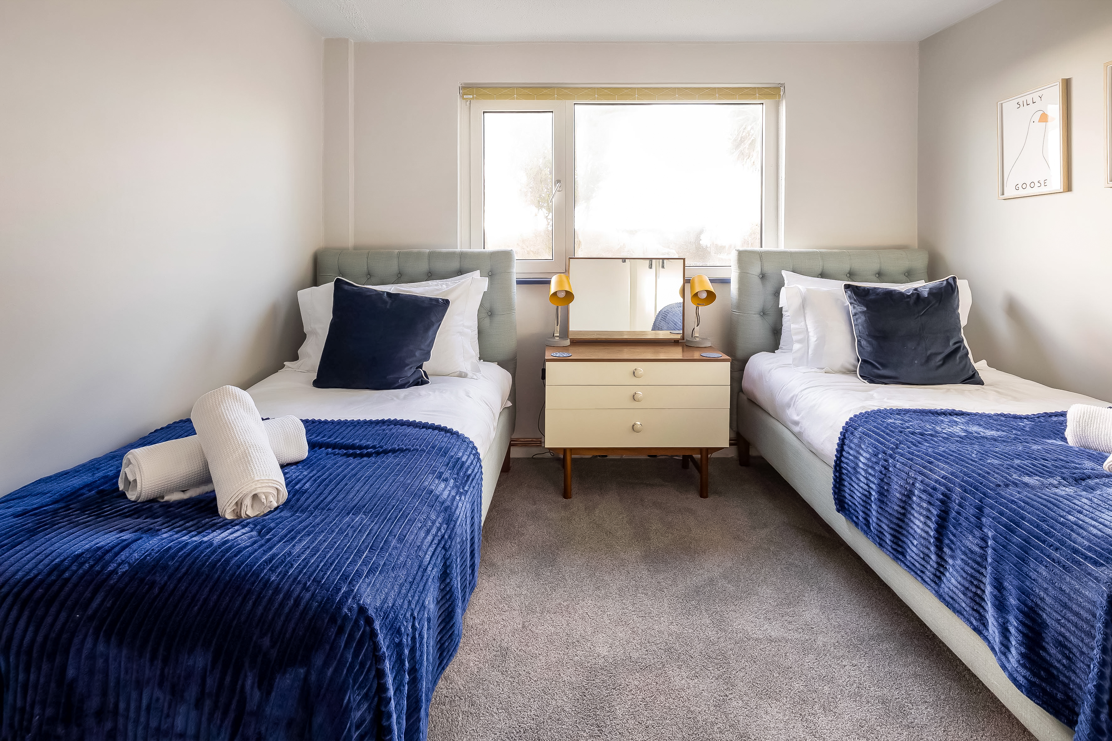 Garden and outdoor seating with coastal views