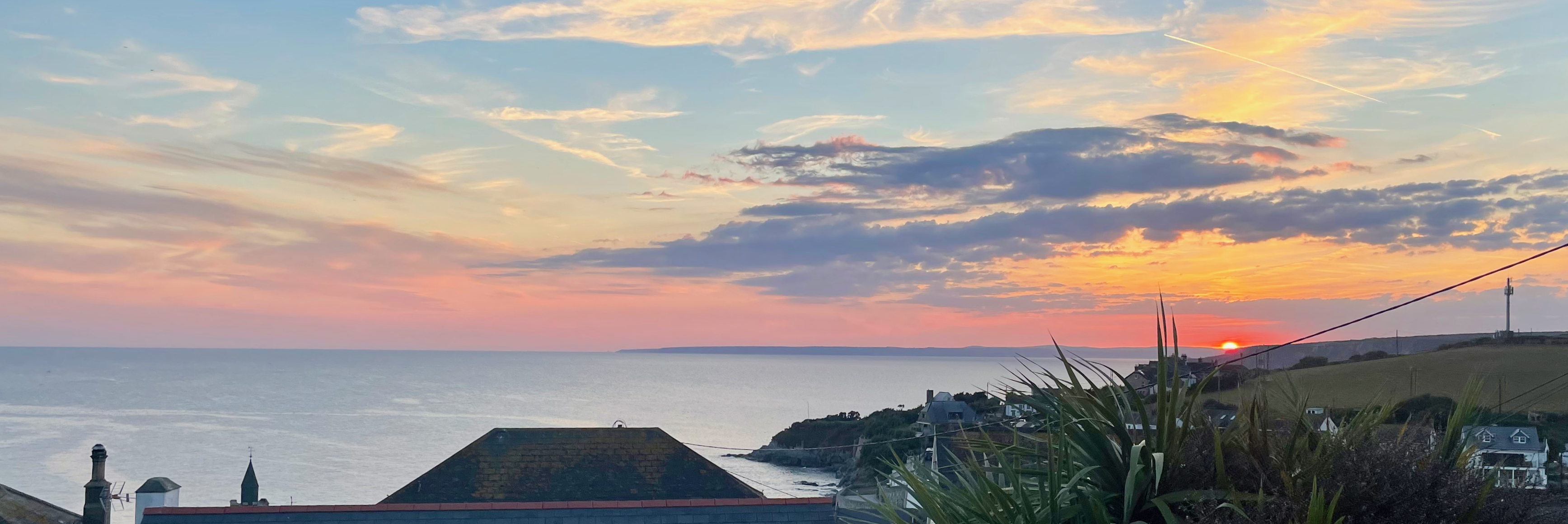 Sunset over Porthleven harbour from Sunset Beach House